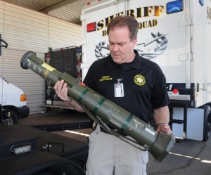 A Stanislaus Sheriff officer displays an “inert” rocket launcher provided by the Pentagon.